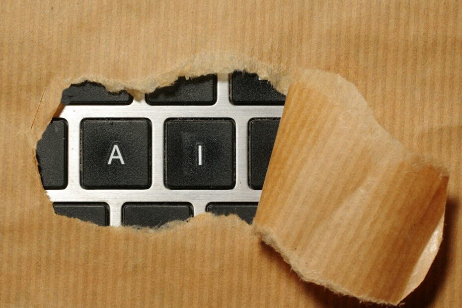 A piece of cardboard with a keyboard appearing through it